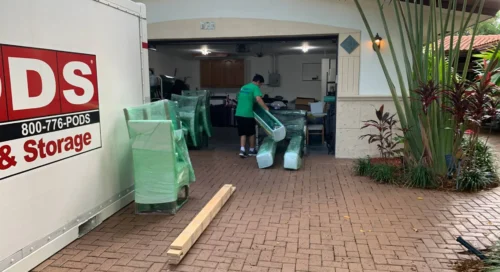 ABA Moving Team Member Loading Packed Boxes and Furniture