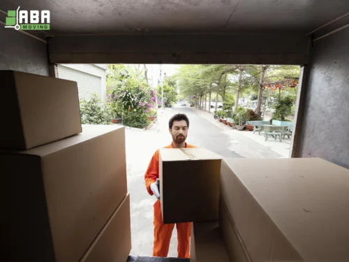 Team Member Loading Boxes ABA Movers Team Member Loading Boxes