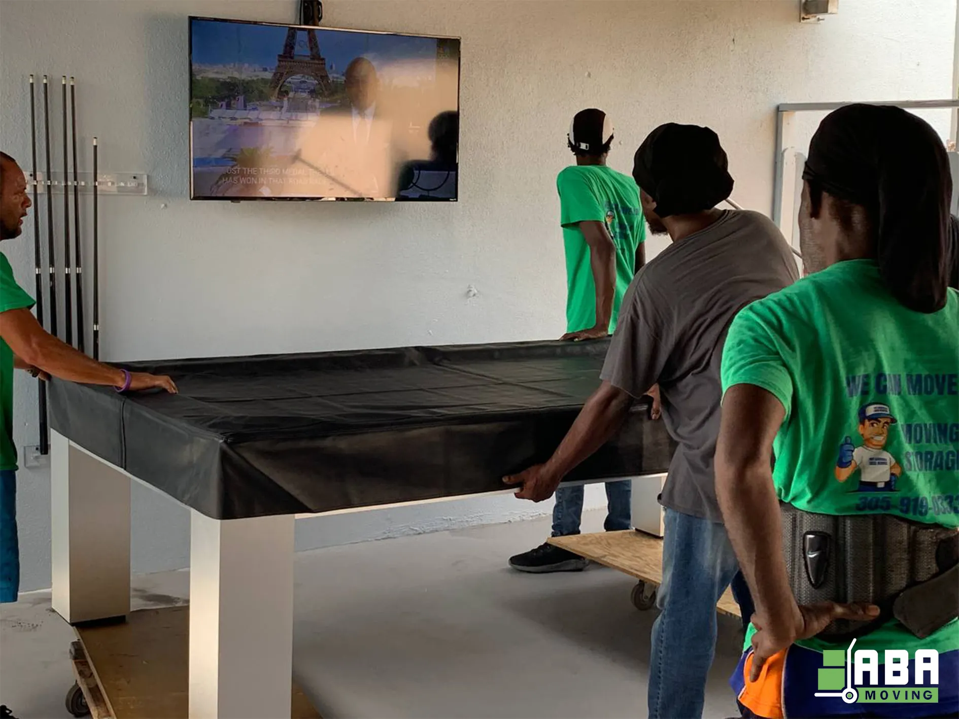 Team Members Packed and Loading Customer Pool Table ABA Moving Team Members Packed and Loading Customer Pool Table