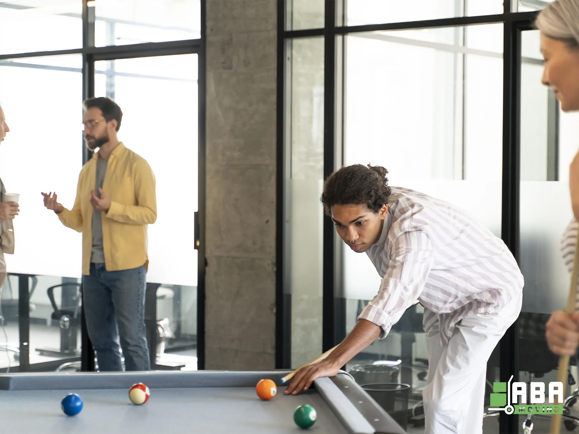 Office Members Playing on Pool Table and Relaxing ABA Movers Office Members Playing on Pool Table and Relaxing