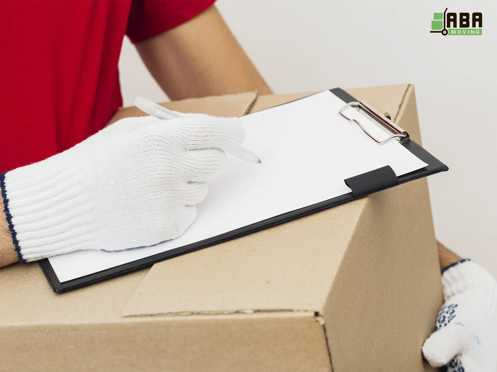 Team Member Checking Customers Boxes ABA Movers Moving Team Member Checking Customers Boxes