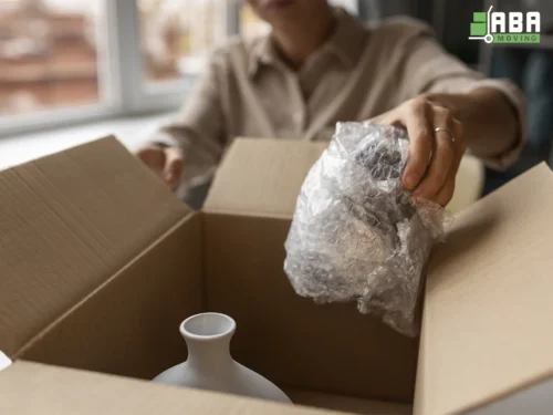 ABA Movers Packing Fragile Customer Items in Boxes