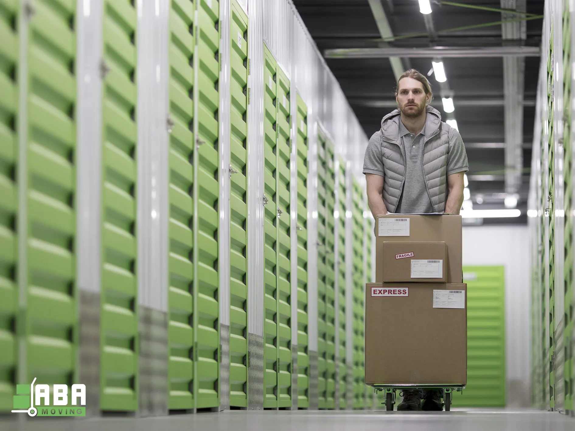 Storage Service Team Member Loading Customer Boxes in Personal Storage