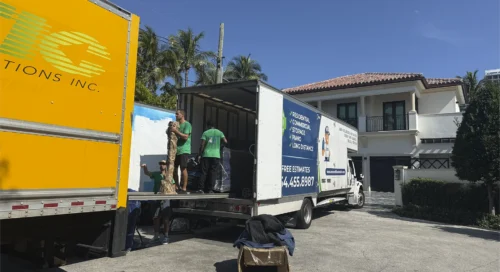Team Member Loading Customer Boxes and Furniture in Trucks