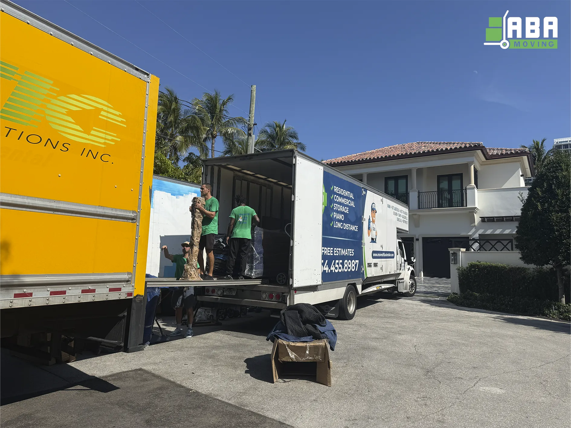 Team Member Loading Customer Boxes and Furniture in Trucks