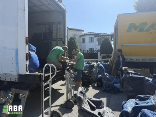 Team Member Loading Customer Furniture and Boxes in Trucks